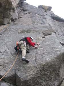 Lenny Miller cruises the crux finger-tip lieback on pitch 3.