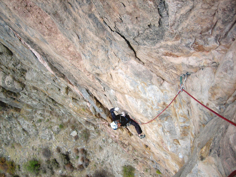 In the midst of the crux heading toward the mantle on P2.