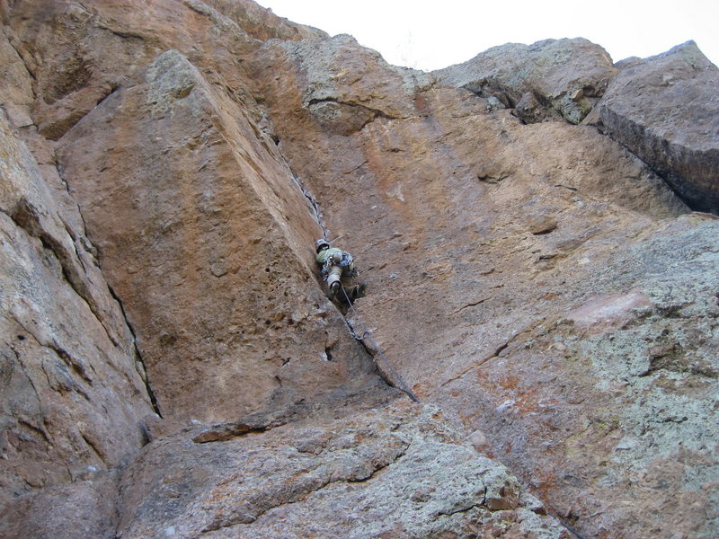 Climber is on Jorgie's Crack; Swallow Crack on left