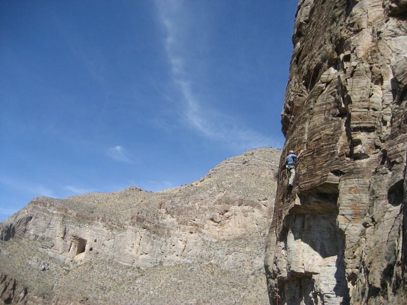 Grady Viramontes on one of the steep lines. The bat cave is visible across the canyon in the back-ground.