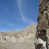 Grady Viramontes on one of the steep lines. The bat cave is visible across the canyon in the back-ground.