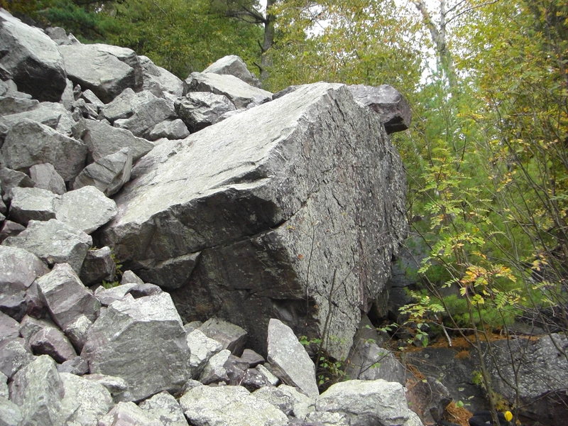 This boulder is very cool.  The boulder is much larger than the picture makes it out.  The face on the right has small side-pulls and pinches and could be very technical.