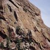 The South Face of Redgarden Wall as seen from the park road. The prominent dihedral left of center is the Rover dihedral. Photo by Tony B., 2007.