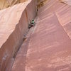 Bad Rad Duality. Ryan Sprackling, left toe on the tiny rest flake between sections of 5.10+.  <br>
<br>
Photo by Emily Kuhr.