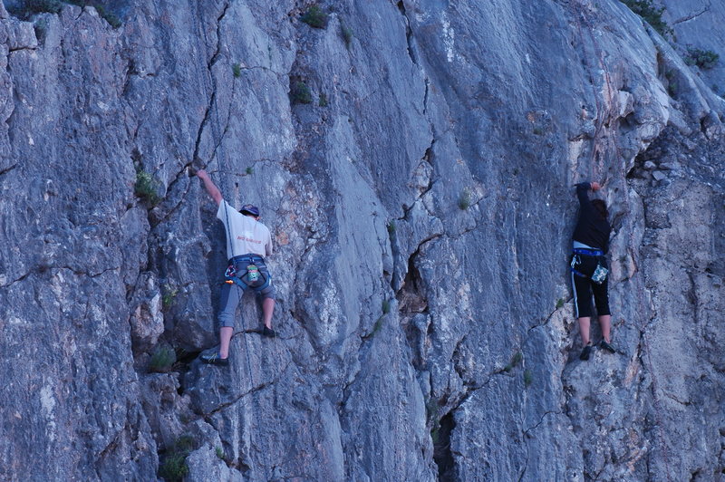 Climbers struggling on the same routes on top rop, with shoes.