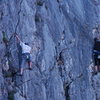 Climbers struggling on the same routes on top rop, with shoes.