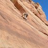 Jim on lead is just about done with the crux moves above the second bolt.