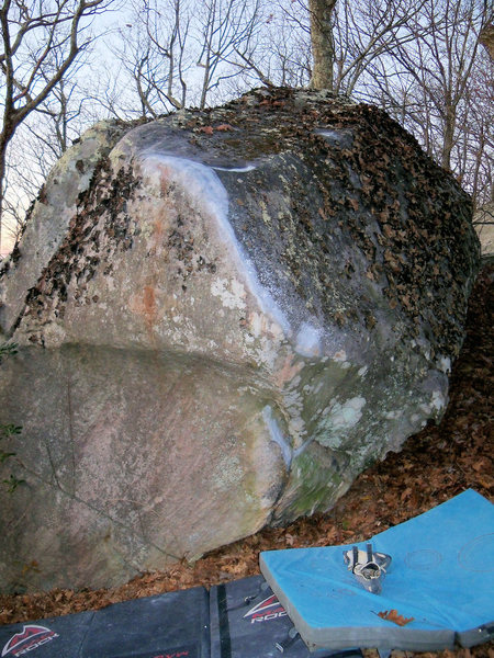 The Secant Boulder, with the "secant line" (V-7+) clearly chalked.