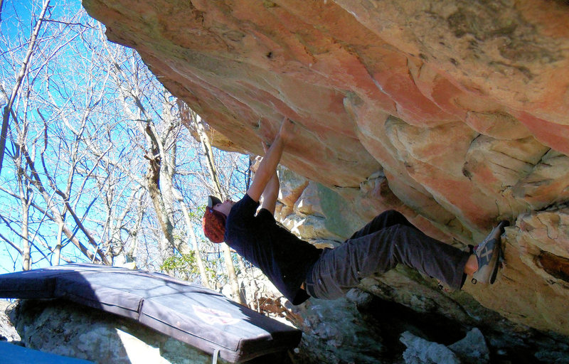 climbing out of the "Warm Up Roof" (V-1) at the bluefield boulders Virginia/West Virginia