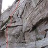 The horn is at the top of the initial arete.  Note - the dead stump is about ready to fall off.