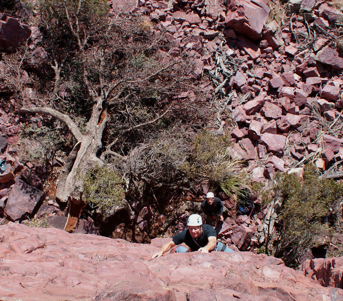 Chris on Giu La Testa; the now fallen Hanging Tree behind him.  Nestor belays.