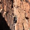 Working the large crack on 'The Broon' at New Castle Crag.