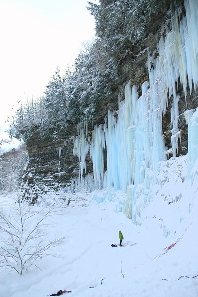 Climber near the top of the ice on Mate, Spawn, and Die.