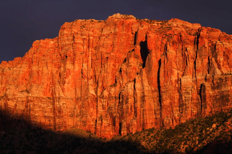 Alpenglow and storm clouds over the Watchman, Zion National Park, Utah.