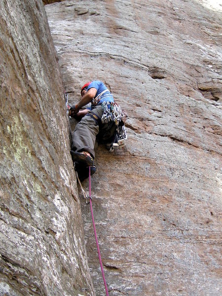 Hanging off a good jam to place gear.  Photo by Huong.