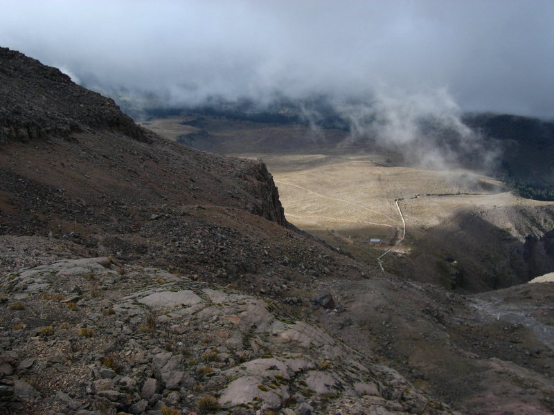 This is the view on the descent.  The refugio is the obvious rectangular structure below, and the well-traveled section of trail is visible on the center-left.  This is taken below the confusing section.