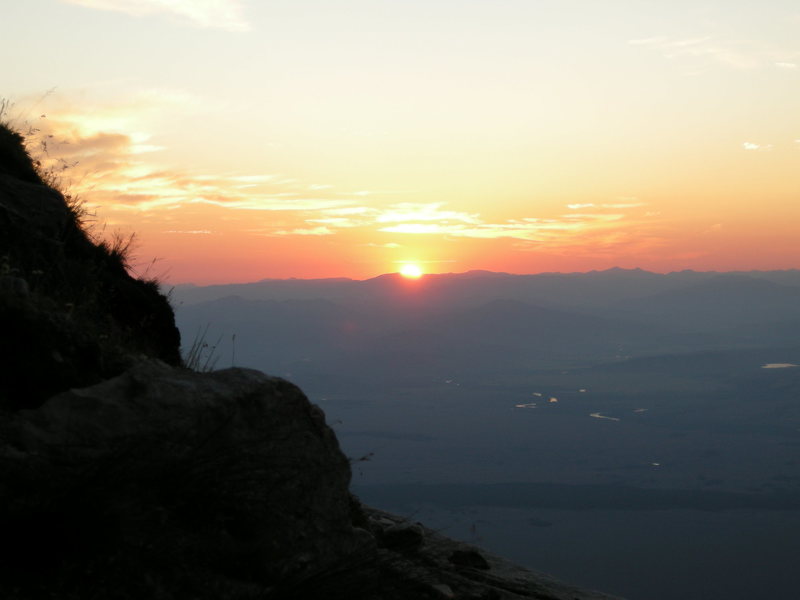 Pretty crappy sunrise near the summit of Teewinot. The snake river shimmers below.