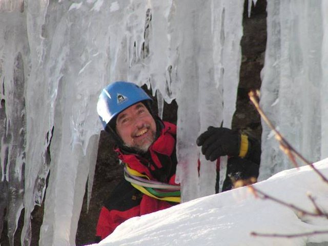 Peering out from behind the last pitch's ice curtain.<br>
Photo by Maurice Corrigan.