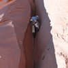 First part of climb up slightly overhanging handcrack in a right facing dihedral.