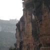 An unknown climber on the classic "L'Escamarla" at La Siuranella.