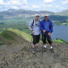 The successful team ,exhausted but happy on the summit of Mt Catbells.The Mountain in the distance is Skiddaw,just over 3000',the third highest mountain in the Lake District.to the right distance Blencathra mountain. The Lake is Derwent Water ,at the top of the lake is the town of Keswick.