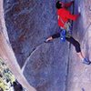 Werner Braun running it out on Astroman (5.11c), Yosemite Valley<br>
<br>
Photo by Charles Cole