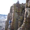 A good shot of the arete with both climber and belayer.  Glen Charnoski climbing and Roth belaying.