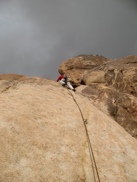 Craig Britton passing the third bolt on McStain (5.8), Joshua Tree NP