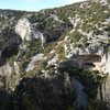 The spire on the left is "Picon d'o Cuervo", the cave immidiately right of the spire is "Pince Sans Rire", which features some of Rodellar's best routes, and the orange cave to the right is "Criminal Tango".  