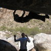 Ian topping out Widowmaker (note: most of the problems on this side of the boulder share this same tricky topout)