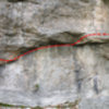 The Kama Sutra Traverse (V3) traverses the cliff face starting right of [[Frog's Head]]105799771, continuing past [[Maria]]105799774 and finishing just past Maria Redirect. 