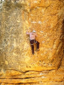 After a dynamic start, juggy pockets lead up the steep orange wall.