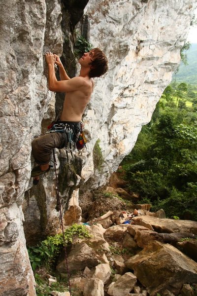 Pier Luigi, happily past the first bolt on Ankiakigokja.  Vang Vieng, Laos.