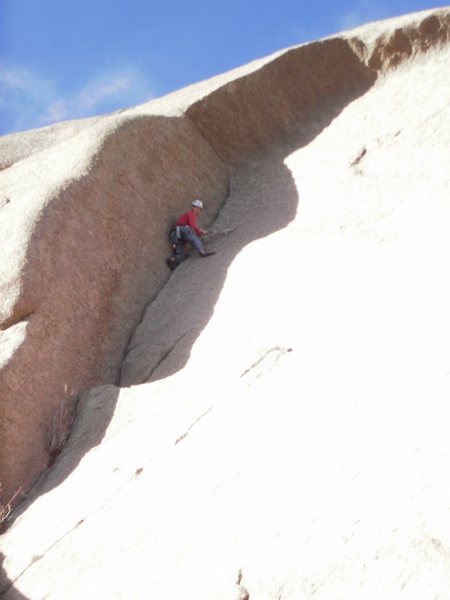 Not satisfied by slab hiking, Too Tall Tim decides to head up a dead end crack.  I think it is called The Gig's Up  5.9.  The bolt fairies have not visited this anchor....  One 1/4" and 2 nuts.  American death triangle so rotted the rings fell off when he touched them. 