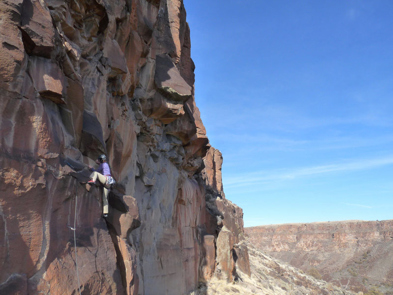 Above the slabby crux at the first bolt and moving into the real fun climbing above. January 2010.