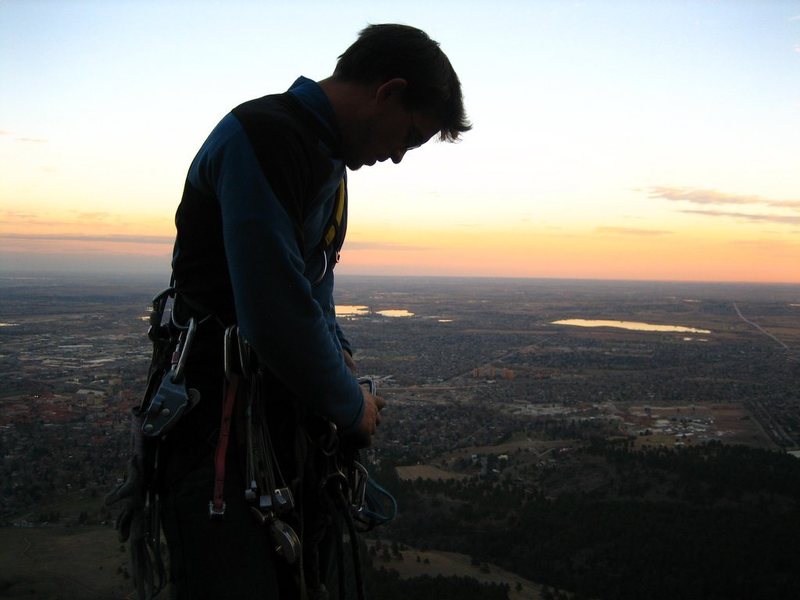 Racking up on the big belay ledge at the 4th pitch.