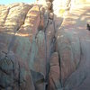 The wider crack to the right of the nice looking finger crack (Southern Comfort) that goes past the chockstone is Route 902.  There is a sling belay at the chockstone.