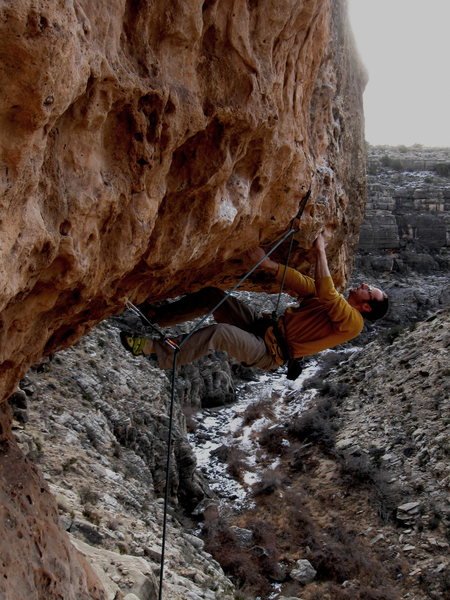 Dan Foster pulling through the roof crux of Big Mouth, 11+, second ascent, Chevelon Canyon, AZ