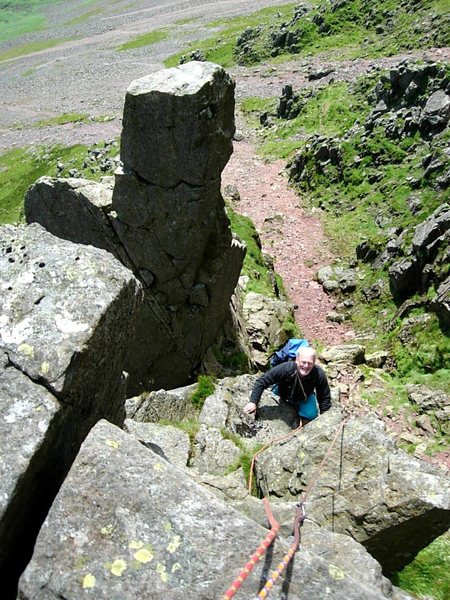 Climber on Needle Ridge ,with the top of Napes Needle behind . Photo Ron Kenyon