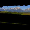 The Tetons through cabin slats.