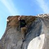 Starting the crux sequence on Antenna Roof, V1