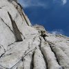 Luke enjoys the amazing alpine granite on one of the upper pitches of the Harding Route on Conness. 