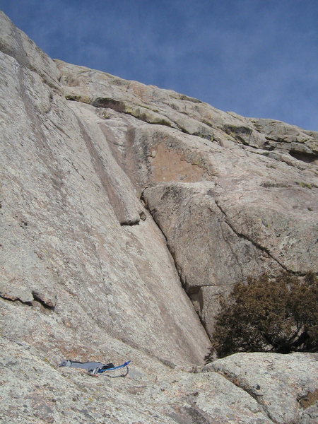 P2 of Jetstream climbs a flake into the super-thin dihedral, and avoids the steep scoop above in favor of face climbing around the right side of the arete.