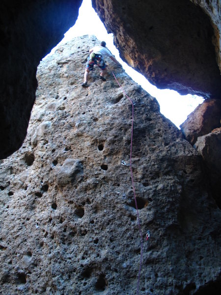 Almost at the top working the arete.