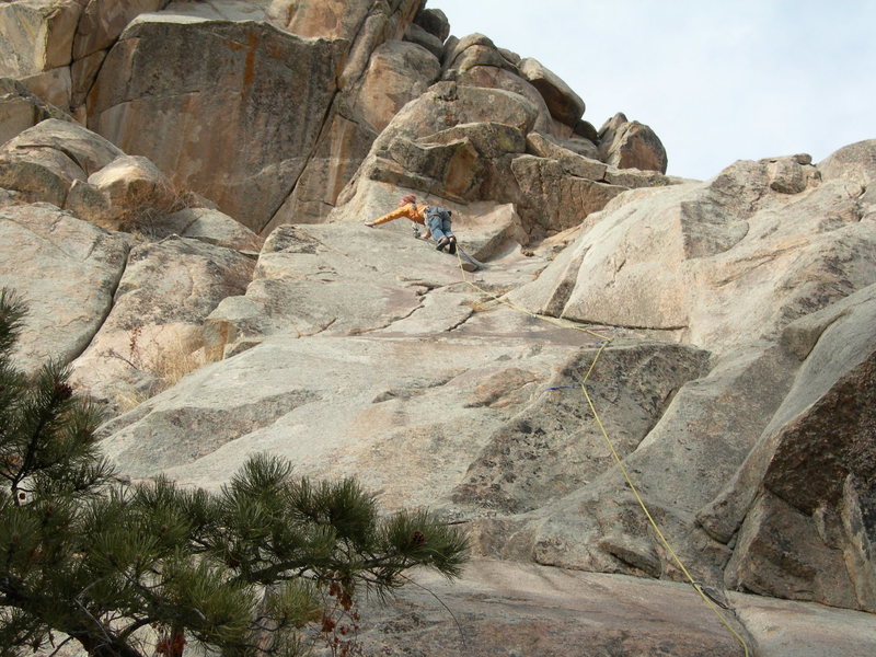 Jim Belcer sussing out the traverse into the big corner / alcove on the FA. 2-4-2006.<br>
<br>
Pitch 2 does not climb the crack through the major roof left of Jim (maybe someday), but the big, left-facing corner to its right instead (out of view). The crux twin cracks on pitch two are visible directly above the roof crack though.