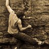 Aaron James Parlier on "Domino" (V-7) in the Belly Boulder Area, Mcafee's Knob, V.A., 2009