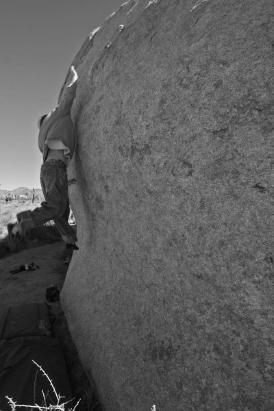 Ted K. goes all points off for a dyno on the asteroid boulder. 