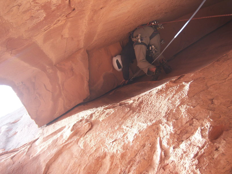Josh working out the roof at the start of pitch 6