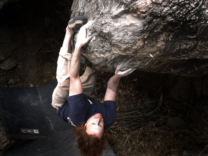 Luke Childers working to cling to "Carrera (V9)."<br>
<br>
Photo by:  Jason Baker.