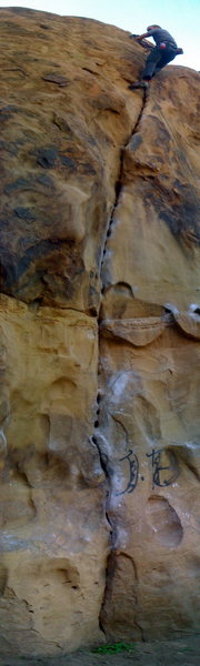 Erik Chimpo Anderson topping out after a beautiful TR redpoint on a beautiful day at Sculptures (3/16/10).